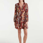 Woman wearing a floral dress on a white background