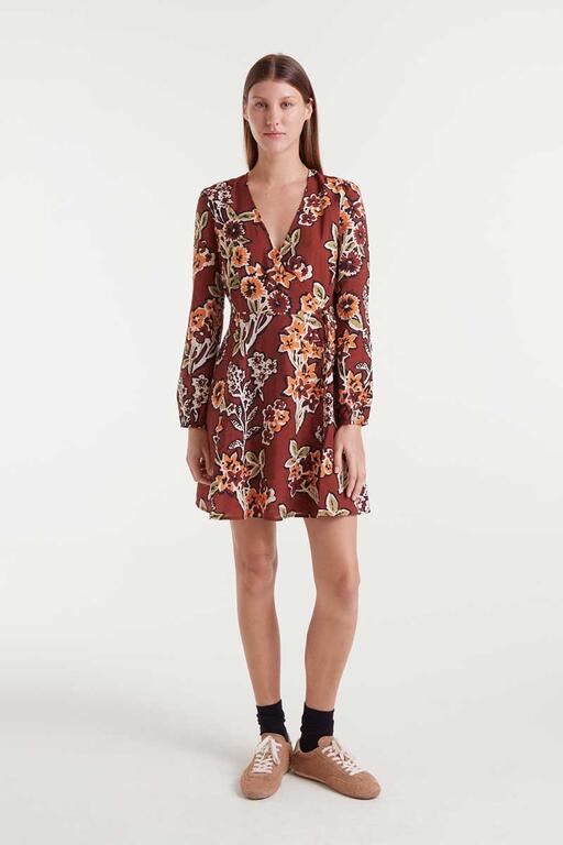 Woman wearing a floral dress on a white background