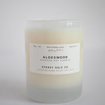 Candle in a frosted cream glass vessel