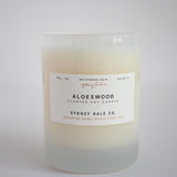 Candle in a frosted cream glass vessel