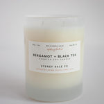 Candle in a frosted cream glass vessel