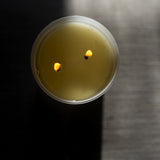 Candle in a frosted cream glass vessel