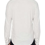 Man wearing White button up shirt and black jeans