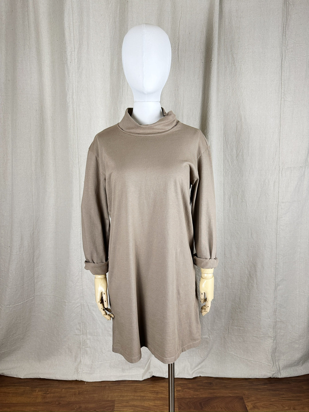 A close up image of the Jersey Turtleneck Dress shown on a female mannequin form