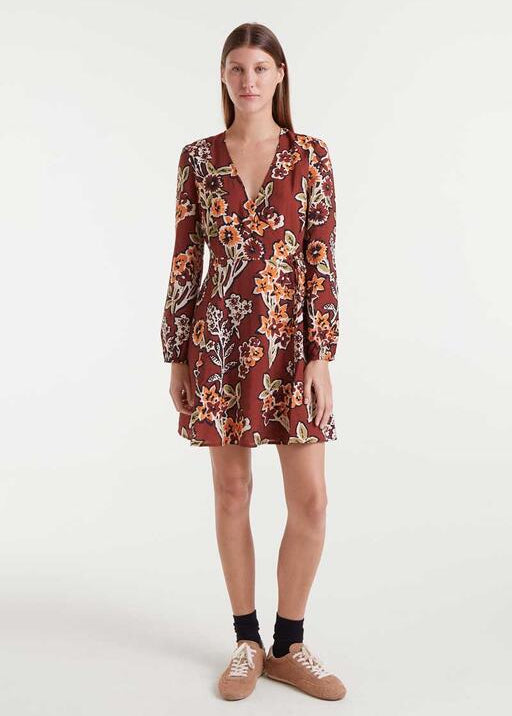Woman wearing a floral dress on a white background