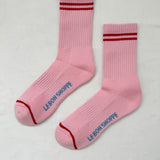 Pink socks with red stripes on a white background.