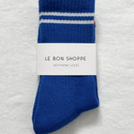 A pair of blue socks with white stripes on a white background.