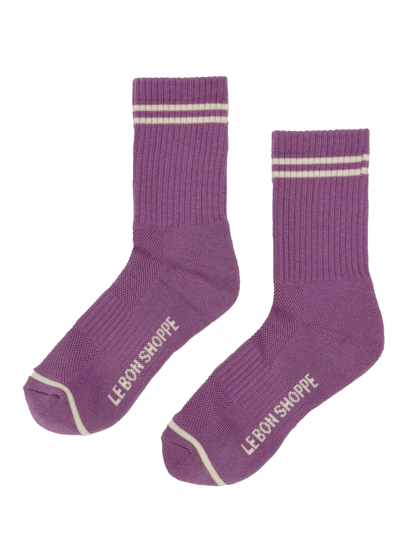 Purple socks with white stripes and 'Le Bon Shoppe' branding on a white background
