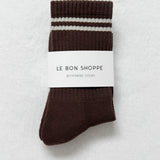 Brown sock with white stripes on a white background, labeled 'Le Bon Shoppe'.