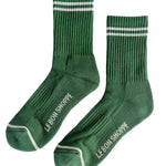 Green socks with white stripes an Le Bon Shoppe branding on white background.