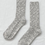 Pair of gray marled socks on a light gray background