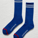 Cobalt socks with white stripes and Le Bon Shoppe branding on white background.