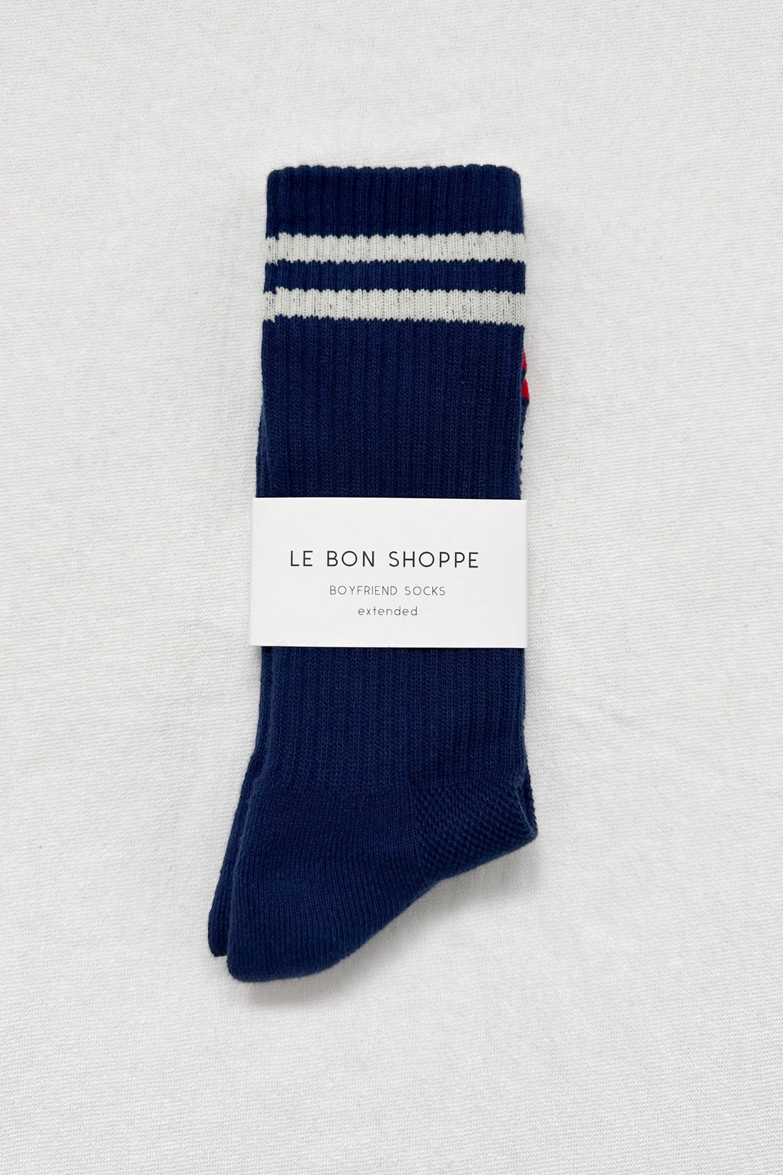 Navy socks with white stripes in white Le Bon Shoppe packaging on white background