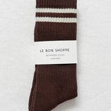 Brown socks with white stripes on a light gray background, featuring 'Le Bon Shoppe' branding.