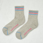 Gray socks with red and blue accents on a white background