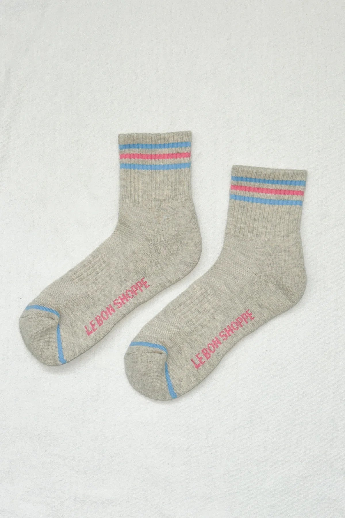 Gray socks with red and blue accents on a white background