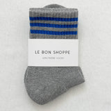 Grey socks with blue stripes in white Le Bon Shoppe packaging on white background