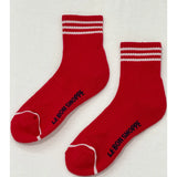 Red socks with white stripes on white background