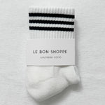 White sock with black stripes on a white background, featuring 'Le Bon Shoppe' packaging.