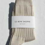 Beige socks with a 'Le Bon Shoppe' label on a light gray background