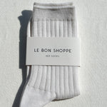 Gray socks with a 'Le Bon Shoppe' label on a light gray background