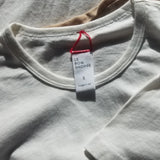 white tee shirt laying on white background