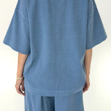 Blue outfit with a t-shirt and pants on a white background