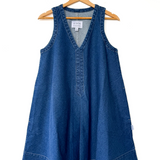 Blue denim dress on a hanger against a white background