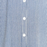 Close-up of a blue and white striped shirt with buttons.