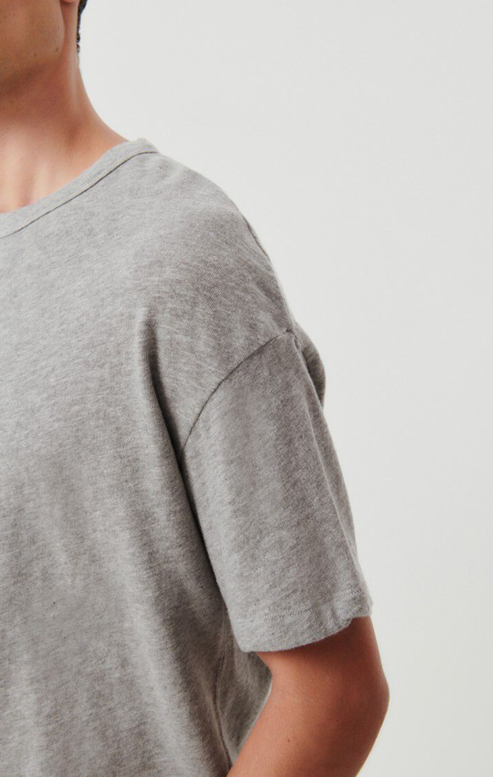 A close up sleeve detail image on a male model wearing the Sonoma T-Shirt in grey