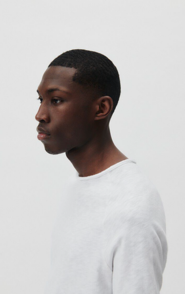 A close up head shot of a a male model at an angle wearing the Sonoma Long Sleeve in white
