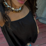 By Orly Jumbo Tigers Eye Necklace worn with layered necklaces
