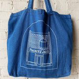 A denim tote with a sketch of the Frances Jaye store front on it.