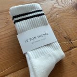 White socks with black stripes in Le Bon Shoppe packing.