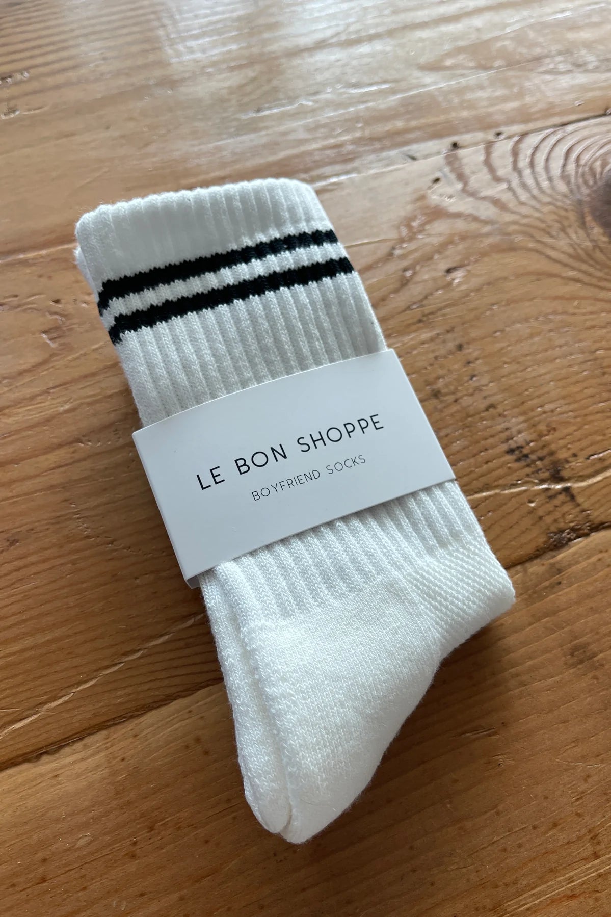 White socks with black stripes in Le Bon Shoppe packing.