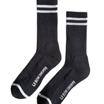 Black socks with white stripes and Le Bon Shoppe branding on white background