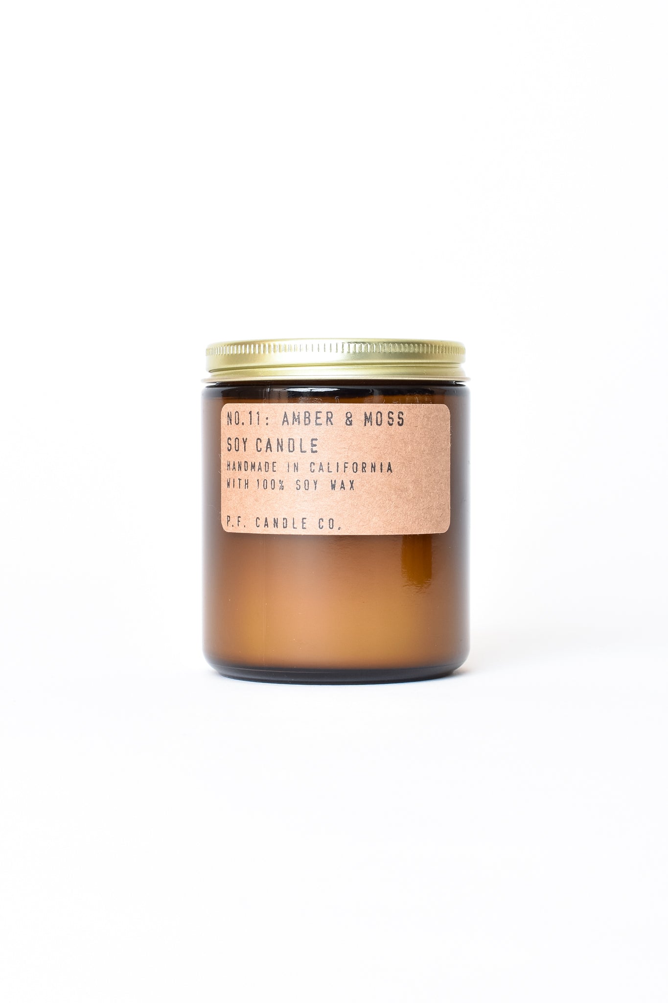 Candle in amber glass jar