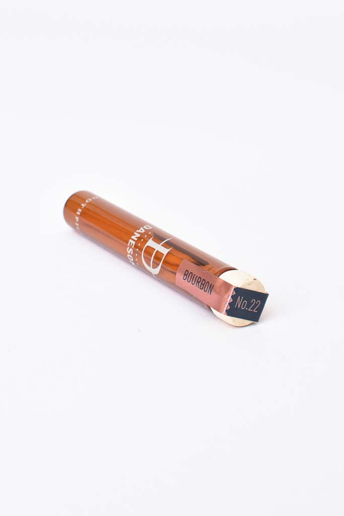 Glass bottle with toothpicks.
