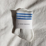 White socks with blue stripes in white Le Bon Shoppe packaging on white background