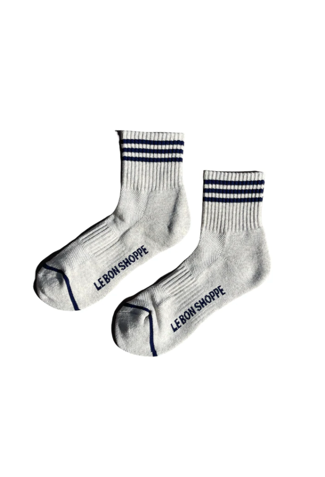 Oatmeal socks with navy stripes on white background