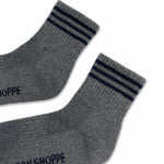 Grey socks with black stripes on white background