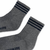 Grey socks with black stripes on white background