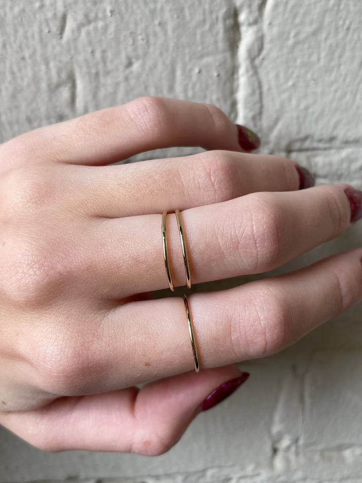Women's hand with simple gold rings