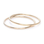 Women's hand with simple gold rings