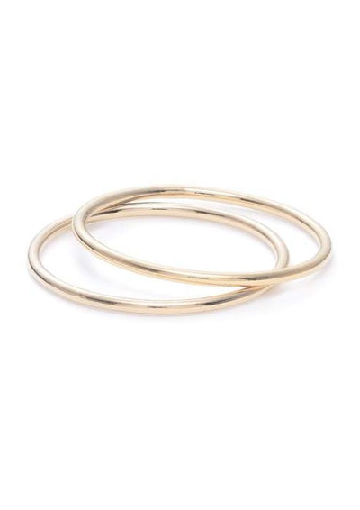Women's hand with simple gold rings