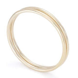 Women's hand with simple gold rings