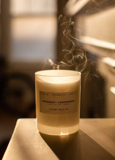Candle in frosted white glass vessel