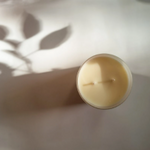 Candle in frosted white glass vessel