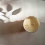 Candle in frosted white glass vessel
