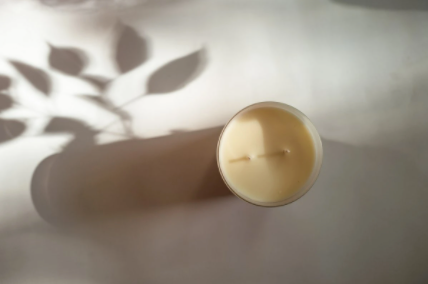 Candle in frosted white glass vessel
